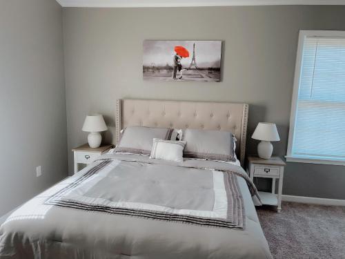 a bedroom with a bed with an orange umbrella at __Kristian’s Palace Your Beach Getaway in Kill Devil Hills