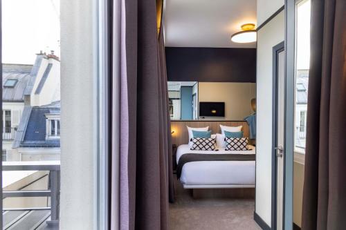 Katil atau katil-katil dalam bilik di Hôtel Opéra Liège