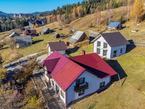 an aerial view of a house with a red roof at Smerichka in Bukovel