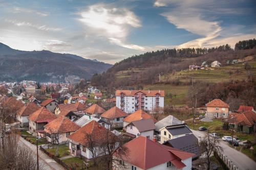 a view of a town with houses and mountains at Modern Mountain - Apartman 401 in Kolašin