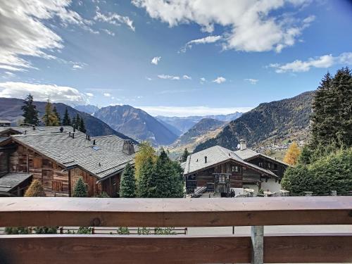 a view from a balcony of a mountain village at Apartment Bruyères A21 in Verbier