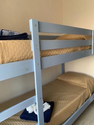 a couple of bunk beds in a room at Casa di nonna Marianna in Baunei