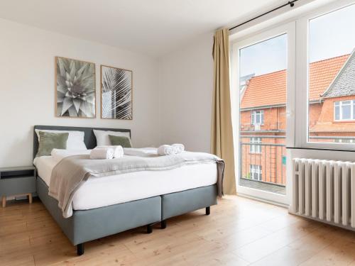 Ένα ή περισσότερα κρεβάτια σε δωμάτιο στο Limehome Kassel Motzstraße