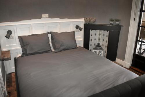 Ένα ή περισσότερα κρεβάτια σε δωμάτιο στο Logement De drie stokvisschen