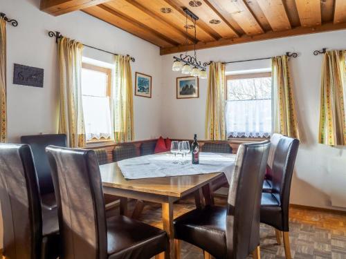 a dining room with a table and chairs at Holiday Home Glatzbichl - WRF120 by Interhome in Pfarrwerfen