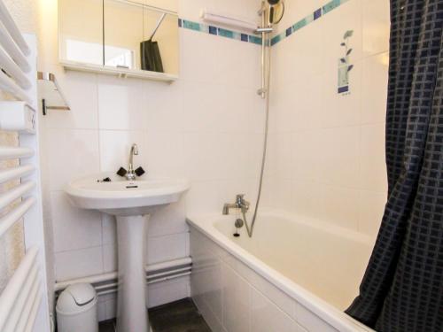 a white bathroom with a sink and a shower at Apartment Balcon d'Huez by Interhome in L'Alpe-d'Huez