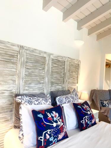 a bedroom with a bed with pillows on it at villa Luberon in Saint-Saturnin-les-Apt