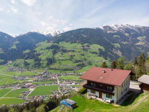 a house on a hill with mountains in the background at Holiday Home Borleitenhof - MHO588 by Interhome in Ramsberg