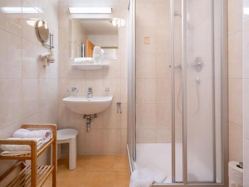 a bathroom with a shower and a sink at Apartment Rosa-2 by Interhome in Mayrhofen