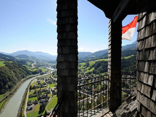 a view of a city from a building with a flag at Apartment Rosi-1 by Interhome in Werfenweng
