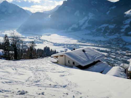 a snow covered house on top of a snow covered mountain at Apartment Anton-2 by Interhome in Ramsau im Zillertal