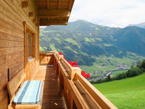 a porch of a cabin with a view of the mountains at Apartment Innergruben - MHO749 by Interhome in Hippach