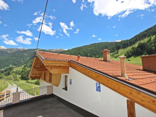 a view from the balcony of a house with a roof at Apartment Vallis Bella by Interhome in Langesthei