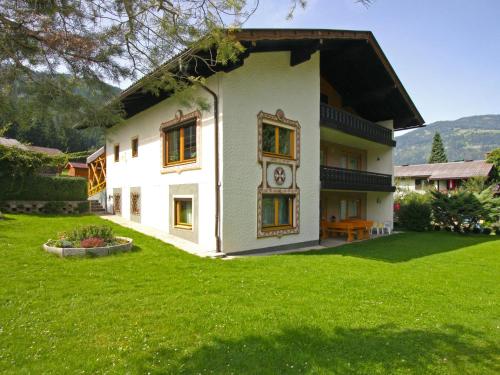 a house with a clock on the side of it at Holiday Home Ferienhaus Haus Kofler by Interhome in Radenthein