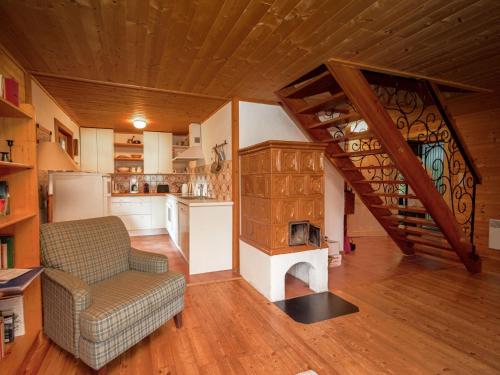 a living room with a couch and a kitchen at Chalet Neunhoeffer by Interhome in Patergassen