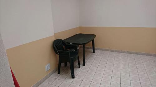 a small table and two chairs in a room at Faro City Center Apartment I in Faro