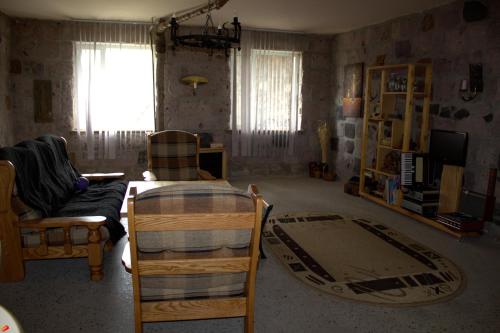 a living room with a couch and a table at Azoyan Holiday Resort in Sisian