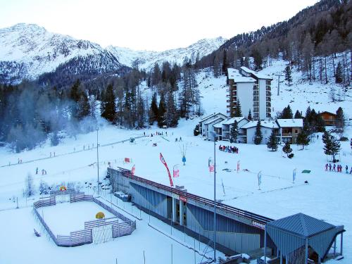 a ski resort in the snow with a ski lodge at Apartment Rosablanche D31 by Interhome in Siviez