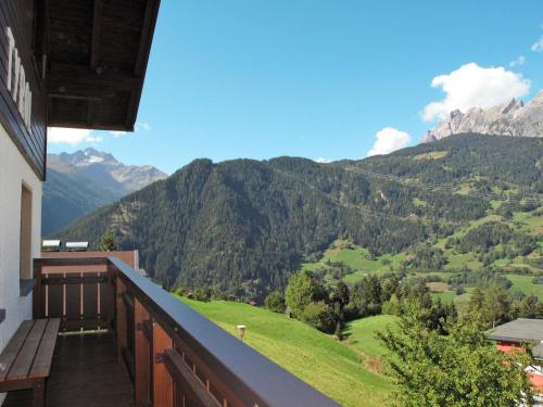 a balcony of a house with a view of mountains at Apartment Tyrol - TDL125 by Interhome in Tobadill