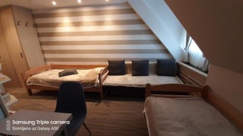 Postel nebo postele na pokoji v ubytování S Konaci