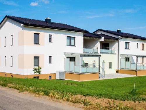 an apartment building with balconies and a street at Apartment Fuchs-1 by Interhome in Donnerskirchen
