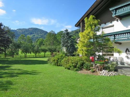 a garden outside a house with a lawn at Apartment Alpenrose - FEK110 by Interhome in Sankt Urban