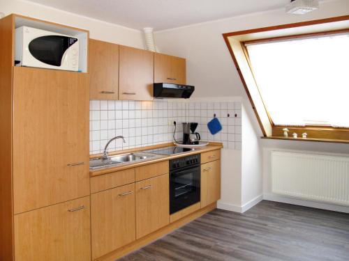 Kuchyň nebo kuchyňský kout v ubytování Apartment Landskron-2 by Interhome