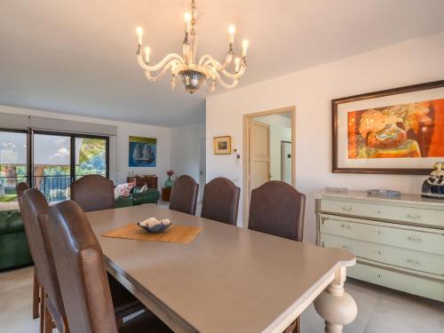 a dining room with a table and chairs at Holiday Home S'Hort des Verger by Interhome in Esporles