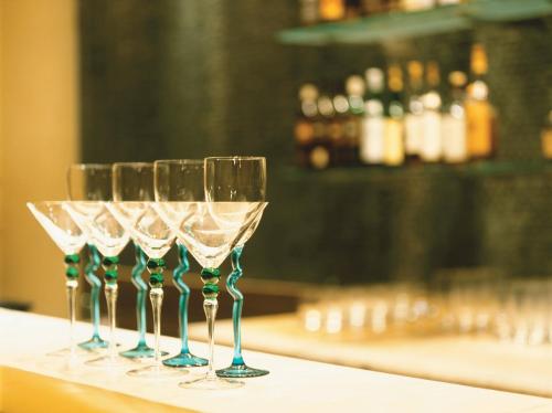 a row of wine glasses sitting on a counter at Trident Nariman Point in Mumbai