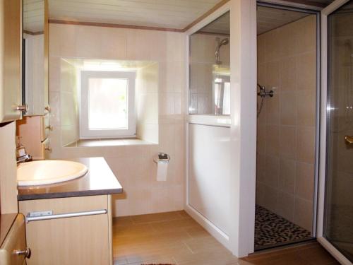 a bathroom with a sink and a shower at Holiday Home Triendl by Interhome in Bischofsmais