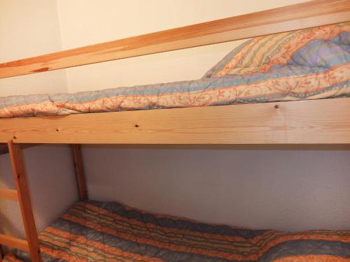 a bottom bunk of a bunk bed in a room at Apartment Les Asters-31 by Interhome in Les Menuires