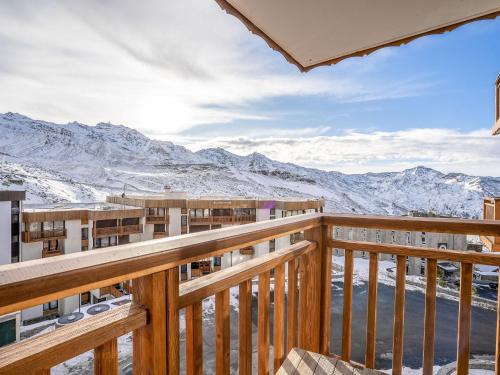 a view from the balcony of a resort with snow covered mountains at Apartment Les Hauts de Chavière by Interhome in Val Thorens