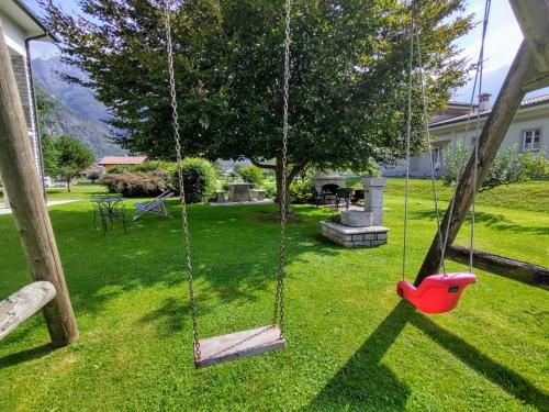 a swing in the yard of a house at Apartment Serena - LMZ180 by Interhome in Riva