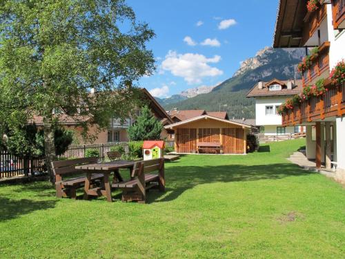 a picnic table in the yard of a house at Apartment Bernard-1 by Interhome in Campestrin