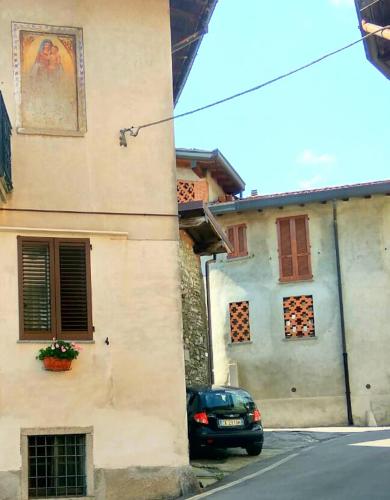 a car parked in front of a building at GrigioPerla in Tavernerio