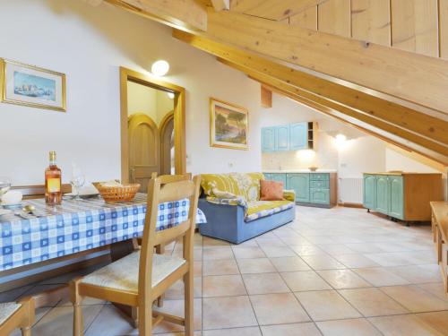 a large kitchen and living room with vaulted ceilings at Apartment Ardoney-2 by Interhome in Campitello