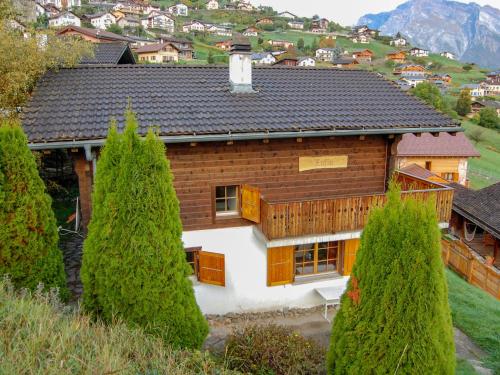 een houten huis met bomen ervoor bij Chalet Chalet Enfin by Interhome in Nendaz