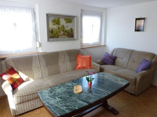 a living room with a couch and a table at Apartment Bless by Interhome in Schutterzell