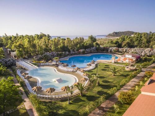 an overhead view of a swimming pool at a resort at Apartment 4 Mori- Residence - MUV100 by Interhome in Costa Rei