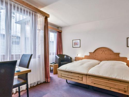 Кровать или кровати в номере Apartment Chalet Abendrot-3 by Interhome