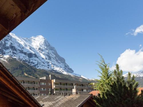 a view of a snow covered mountain from a building at Apartment Chalet Abendrot-6 by Interhome in Grindelwald