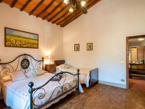 Ένα ή περισσότερα κρεβάτια σε δωμάτιο στο Holiday Home Poggio Cuccule by Interhome