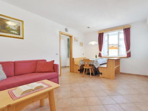 a living room with a couch and a table at Apartment Fabio Deluca by Interhome in Vigo di Fassa
