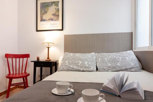 Säng eller sängar i ett rum på SW Soho Family Apartment