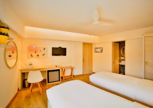 Postel nebo postele na pokoji v ubytování Bloom Hotel - Juhu