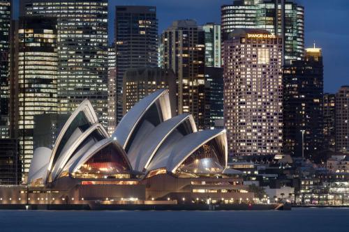 a view of the sydney opera house at night at Shangri-La Sydney in Sydney