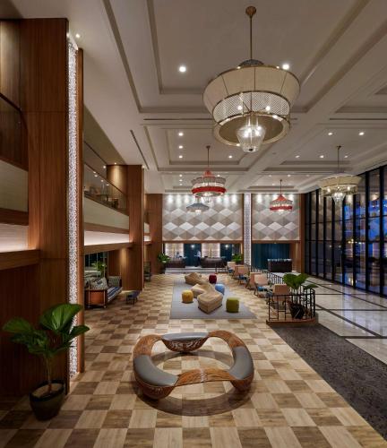 a lobby of a hotel with couches and tables at JEN Penang Georgetown by Shangri-La in George Town