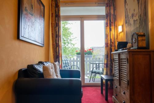 Χώρος καθιστικού στο Hotel Landhaus Knappmann