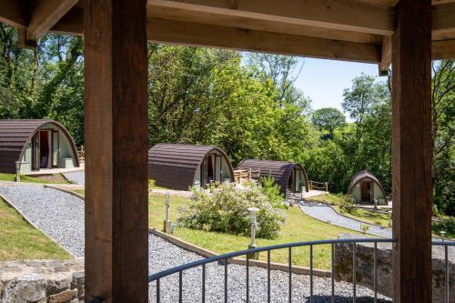 a view of a group of huts in a garden at Pods at Broadway in Laugharne
