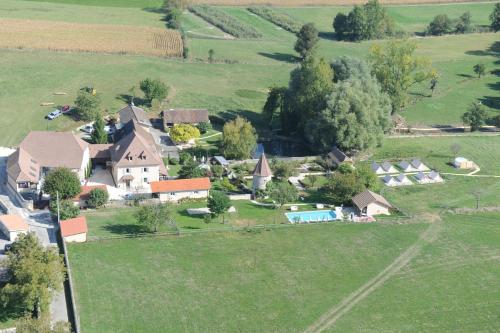 an aerial view of a large house in a field at Domaine de Suzel in Vignieu